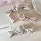 Beau printed bow banana clip in floral pattern on white background