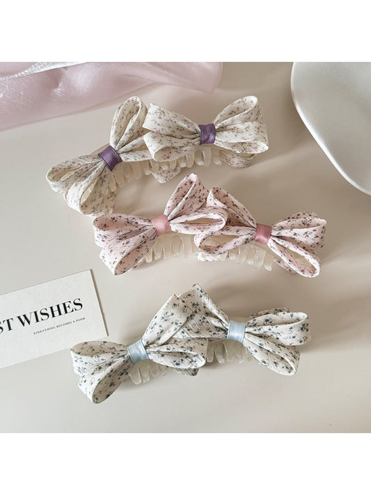 Beau printed bow banana clip in floral pattern on white background