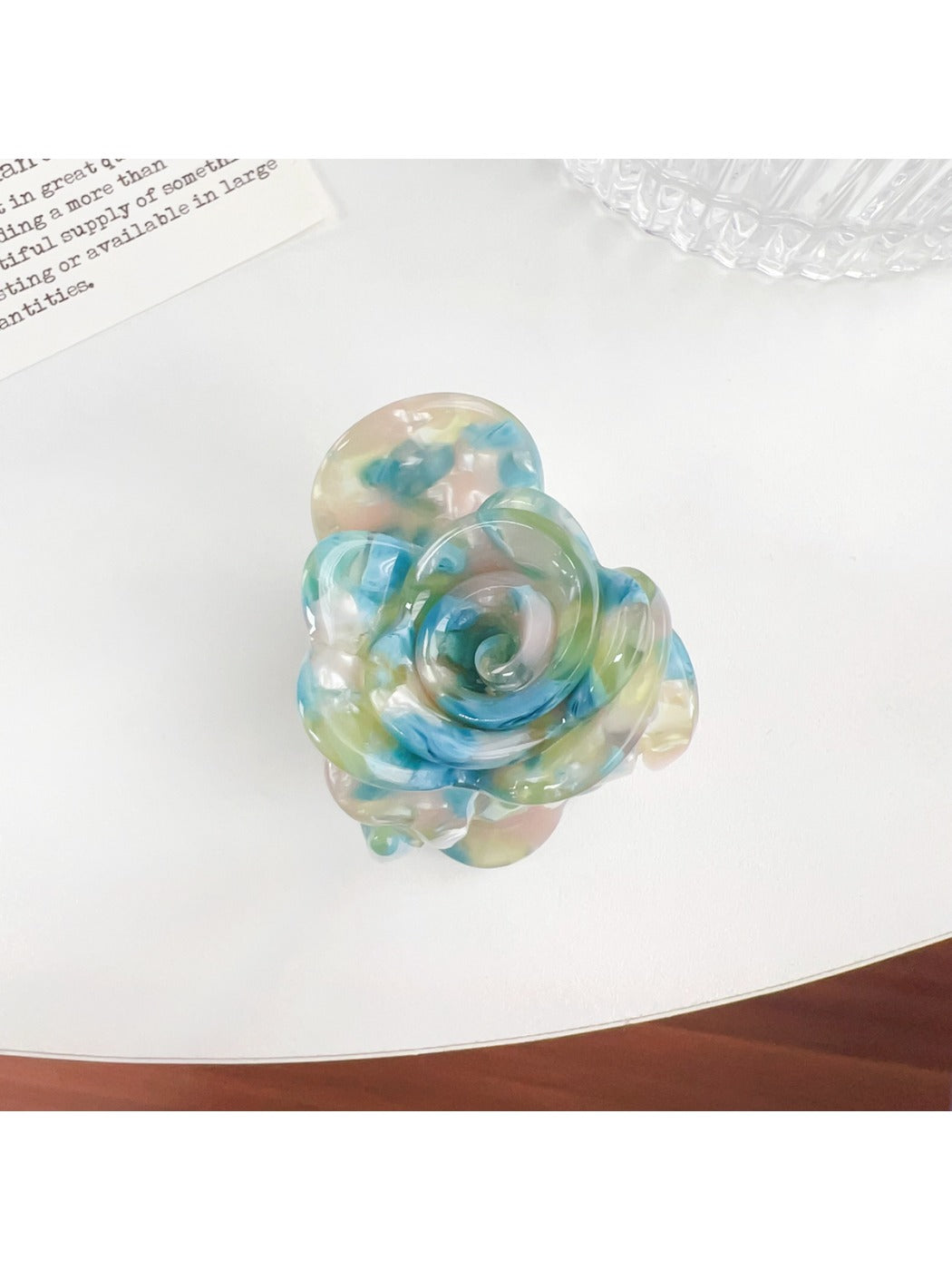 Beau Sweet Rose hair claw clip with pink rose decoration angled to show clip teeth
