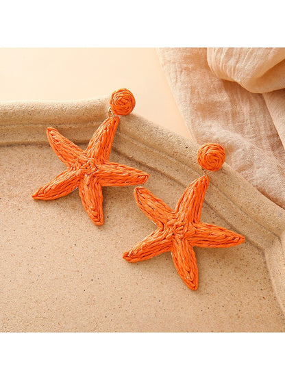 Pair of starfish shaped drop earrings with polished silver finish