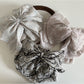 Beau chiffon bow shaped claw clip in soft pastel pink on white background