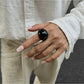 Lovra open cuff bracelet worn on wrist with casual outfit