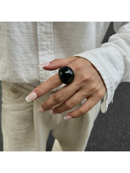 Lovra open cuff bracelet worn on wrist with casual outfit