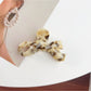 Beau bow shaped hair claw clip showing clasp mechanism and teeth