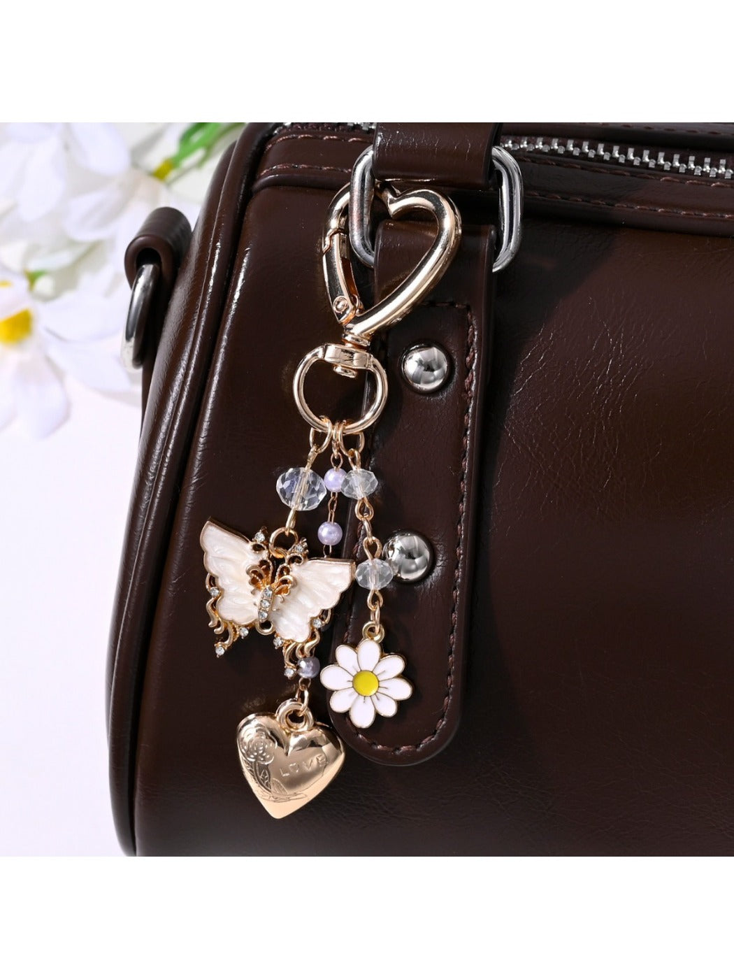 Close-up of butterfly heart keychain showing detailed wing patterns and metal ring