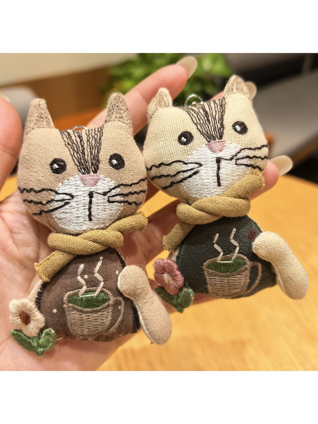 Side view of vintage cat charm keychain highlighting thickness and craftsmanship