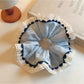 Gifty ruched scrunchie showing color block design with pink, beige, and cream tones