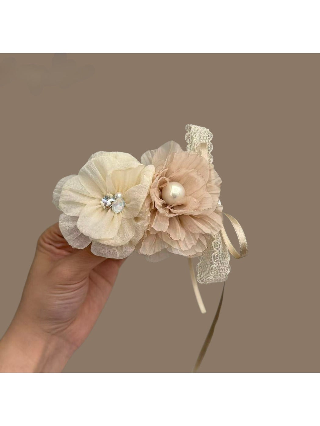 White flower shaped hair clip with detailed petals and a glossy finish