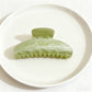 Beau claw clip in pastel yellow with smooth matte texture