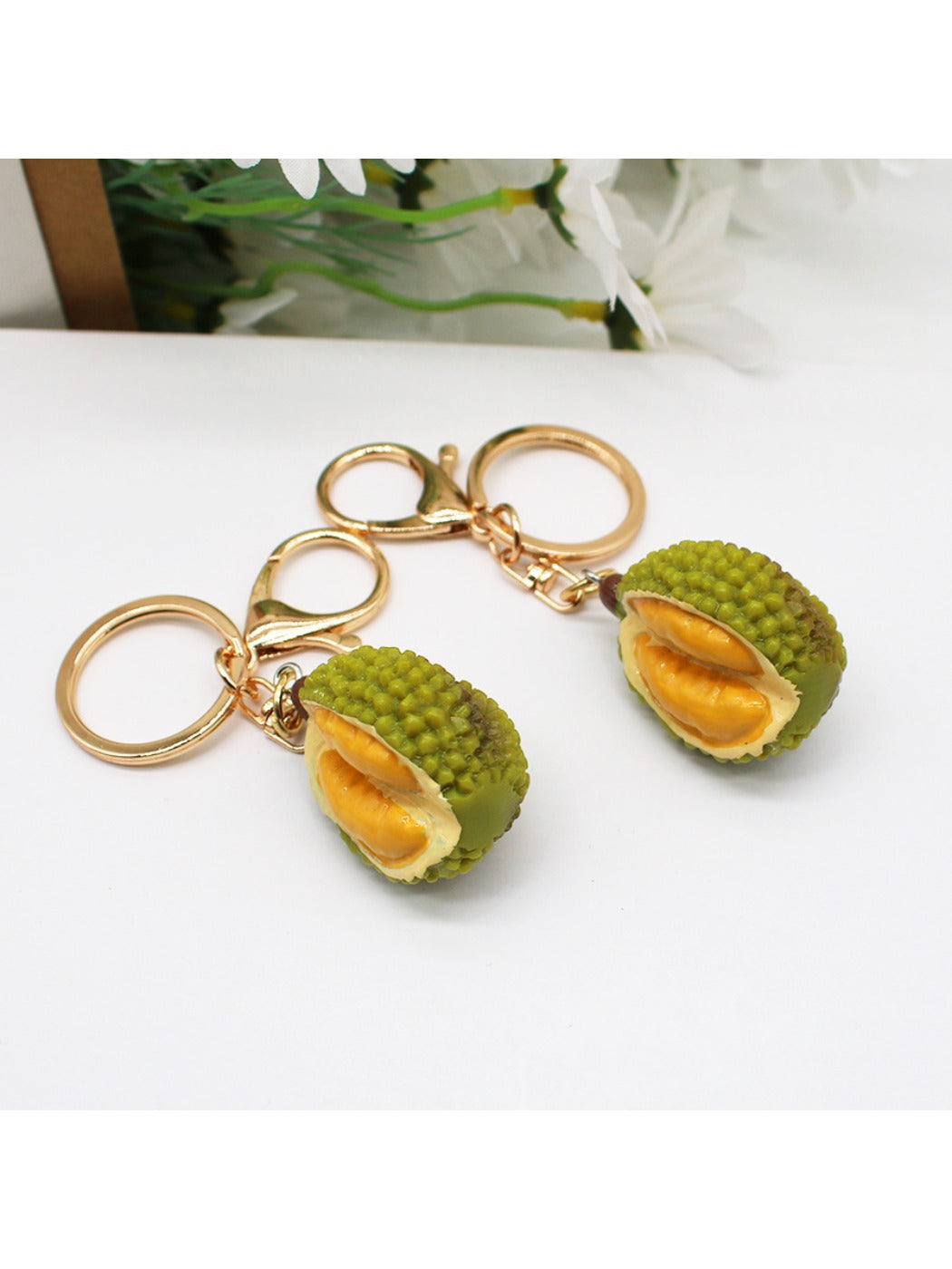 Side view of the durian keychain showing detailed spikes and realistic coloring