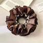 Gifty vintage dark double layered scrunchie styled in a ponytail on a model