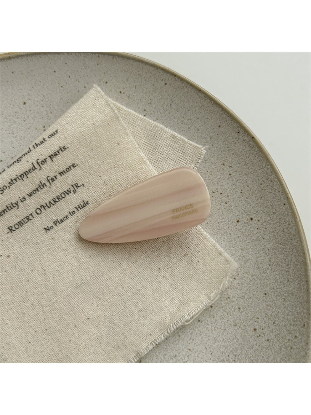 Beau acetate hair clip with pink marbled pattern close-up