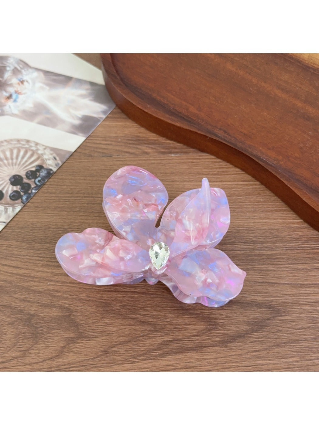Beau acetate moth orchid claw clip worn in hair styled in loose waves