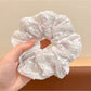 Gifty tiny floral print scrunchie packaged in clear plastic bag