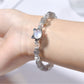 Side view of Lovra minimalist bracelet showing gray crystal beads and silver accents