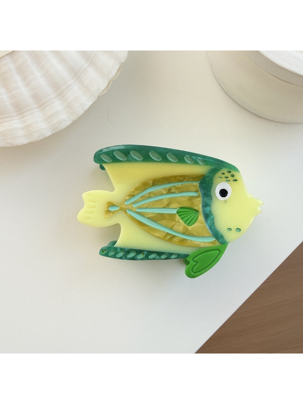 Beau fish shaped claw clip with detailed scales and fins in bright colors