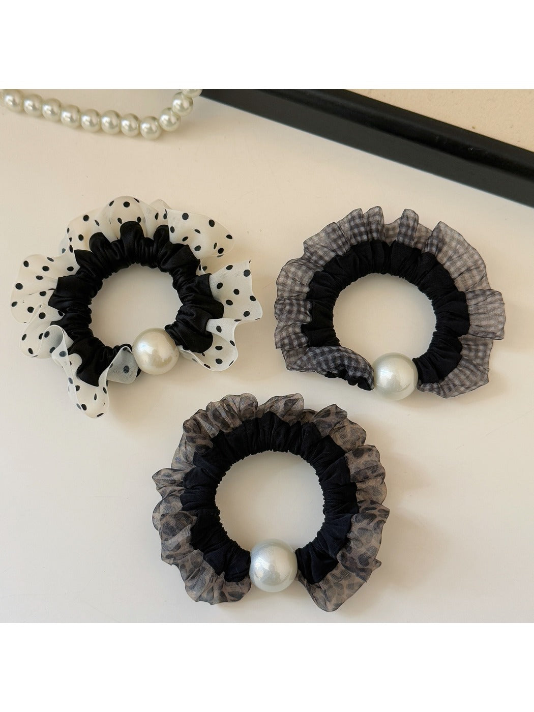 Set of trendy hair ties with plaid and polka dot patterns in various colors