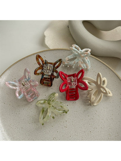 Beau butterfly claw clip open, displaying inner clasp and hinge details