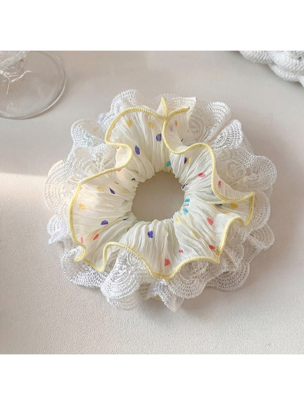 Top view of Gifty polka dot scrunchie emphasizing the ruched fabric detail