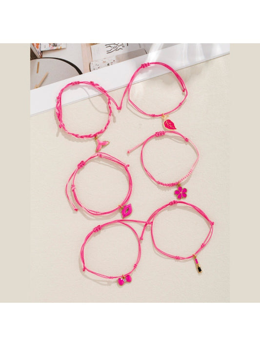 Lovra bracelet with lipstick bow-shaped pendant on woven band