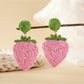 Earedge raffia woven strawberry earrings paired with casual outfit