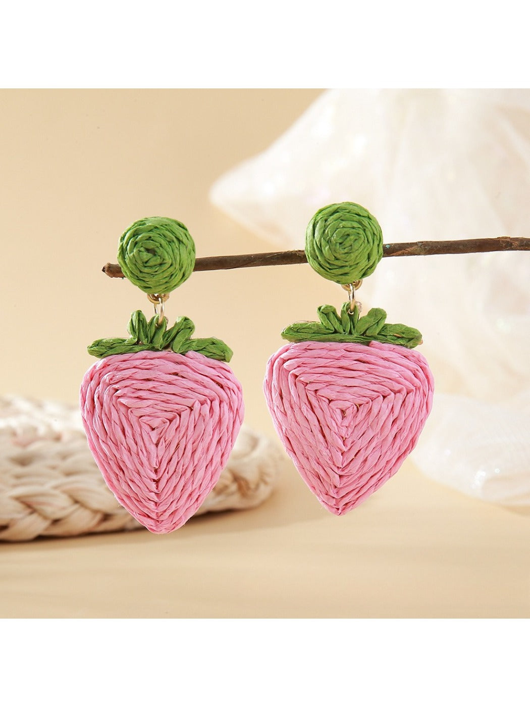 Earedge raffia woven strawberry earrings paired with casual outfit