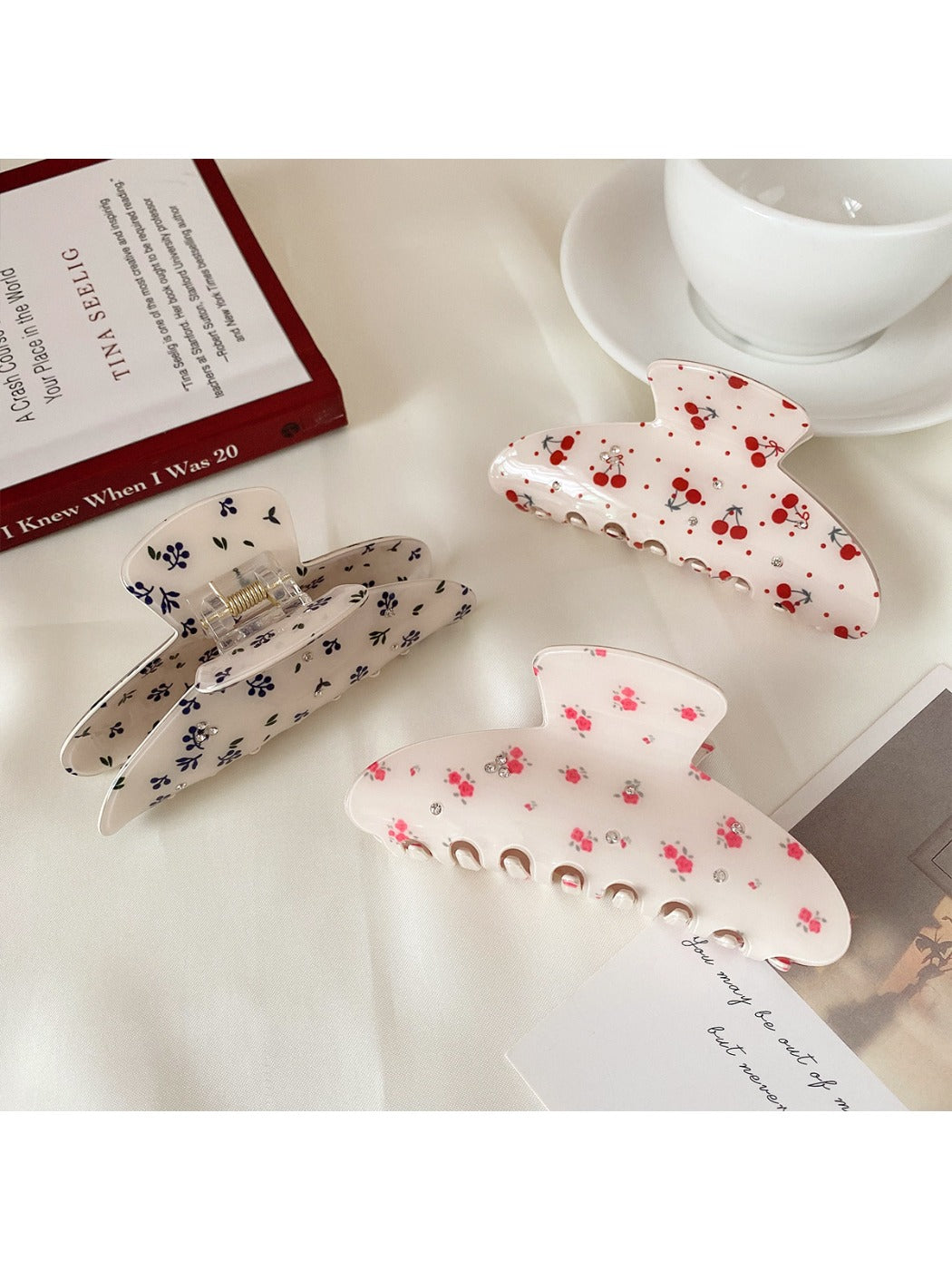 Close-up of Beau hair claw clip showing curved half moon shape and vibrant print