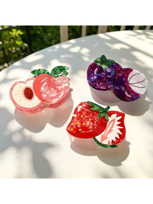 Beau lifelike fruit claw clip shaped like a peach with green leaves