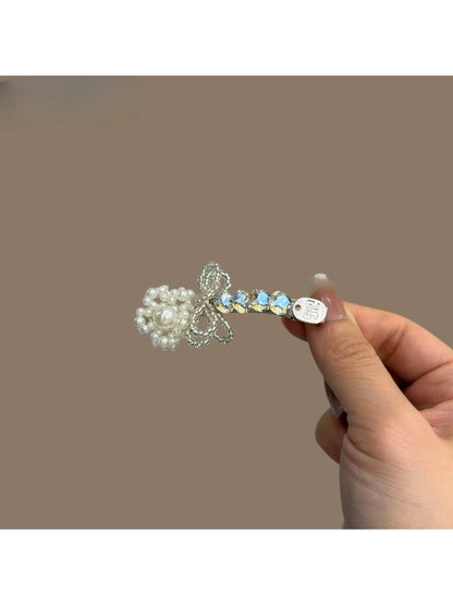Side view of Beau bow hair clip showing rhinestone details