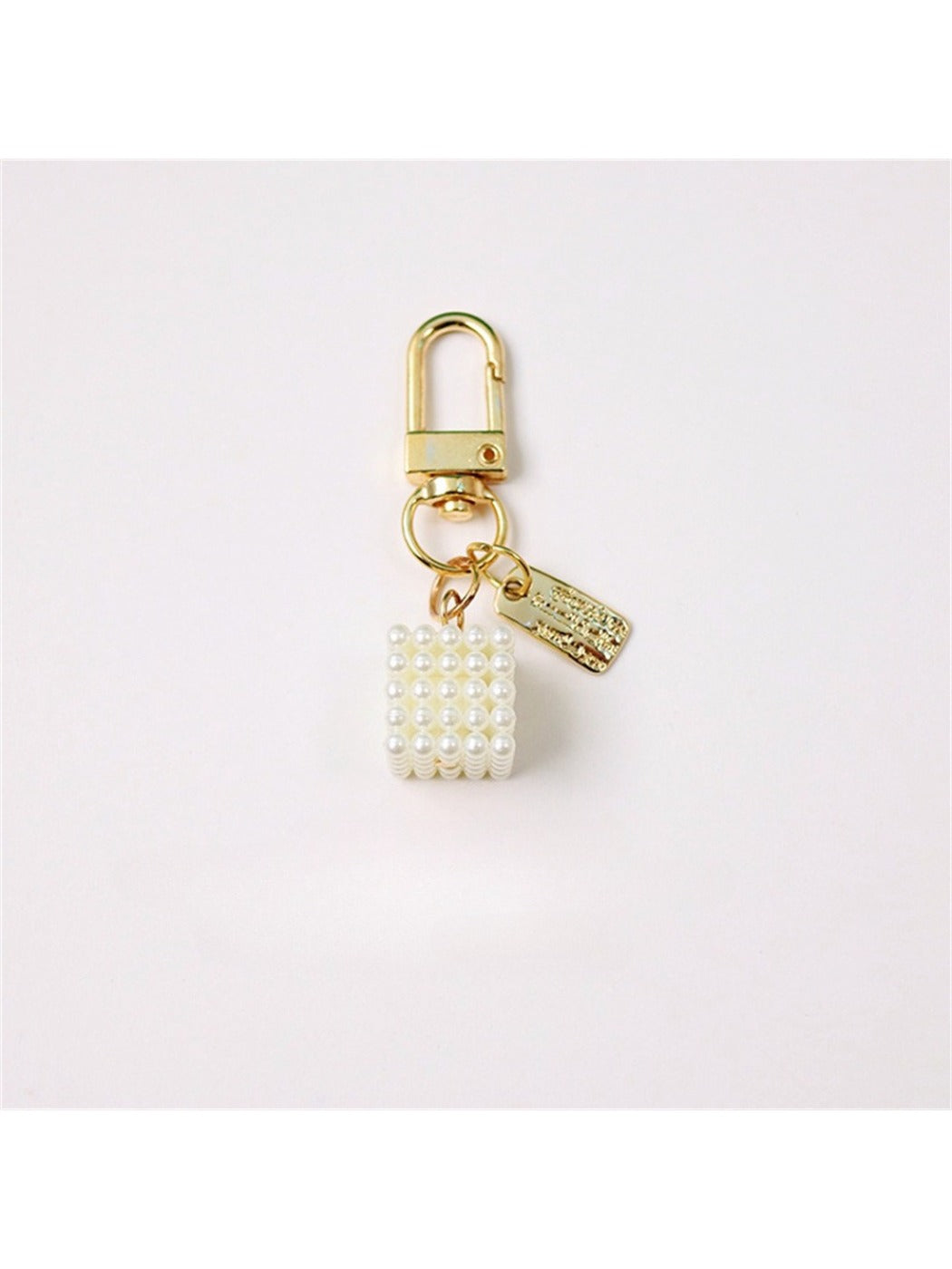 Keypus trendy keychain with multicolored beads and bow charm displayed on a wooden surface