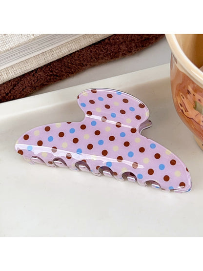 Beau pink polka dot claw clip open to show inner clasp and teeth details