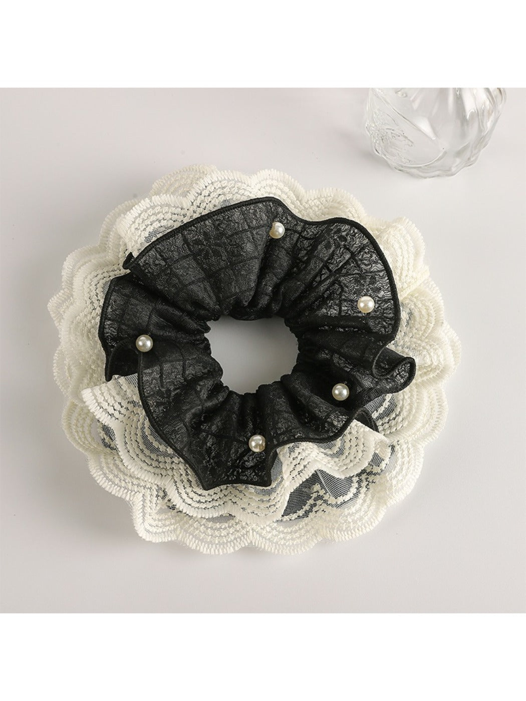 Gifty scrunchie in soft pastel colors arranged with matching accessories
