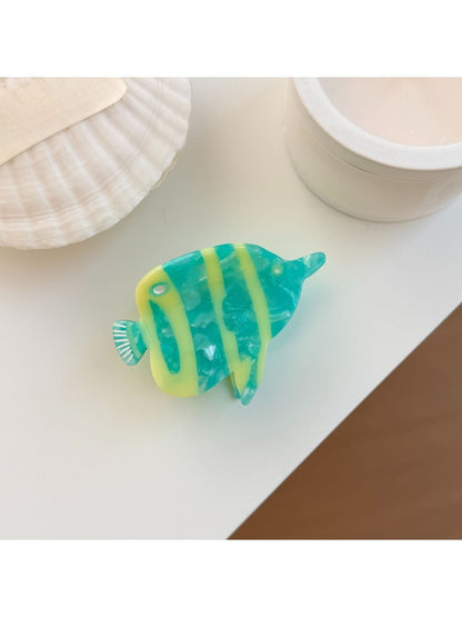 Beau fish shaped claw clip with intricate painted details and smooth finish