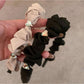Side view of heart shape rhinestone headband showing metal band and stone details