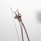 Side view of brown tone cartoon keychain highlighting its thickness