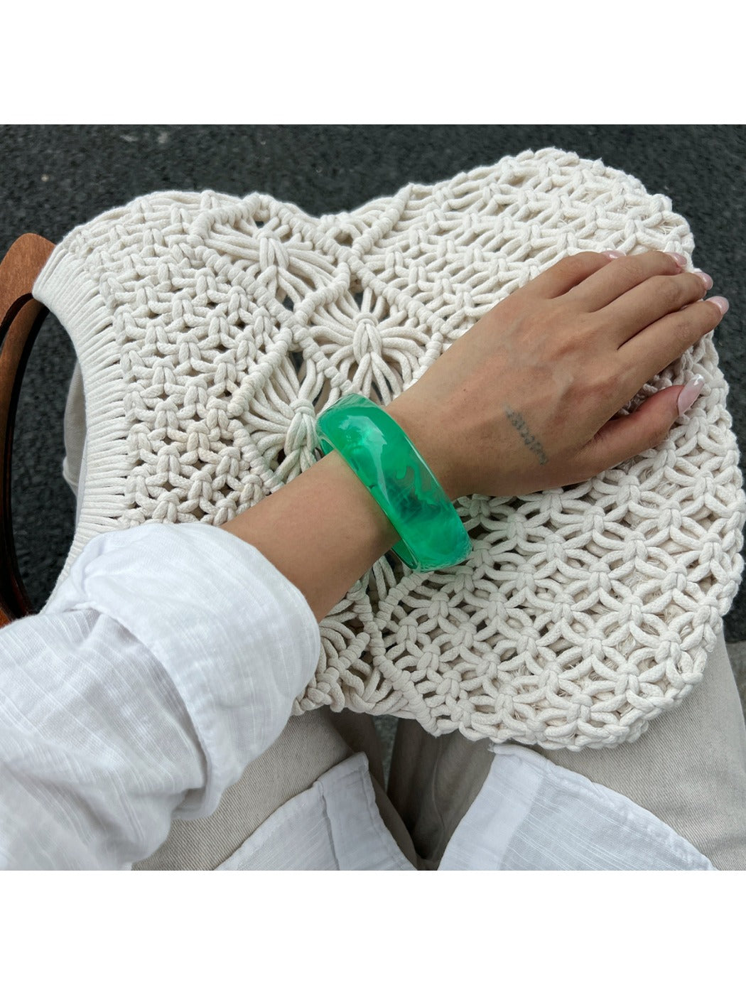 Top view of Lovra irregular shaped bangle bracelet illustrating its open-ended design