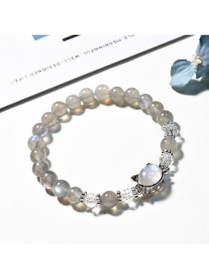 Close-up of Lovra minimalist gray crystal beaded bracelet on a white background