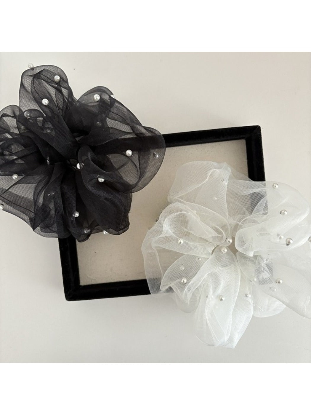 Side view of Gifty elegant chic tulle scrunchie showing layered tulle texture
