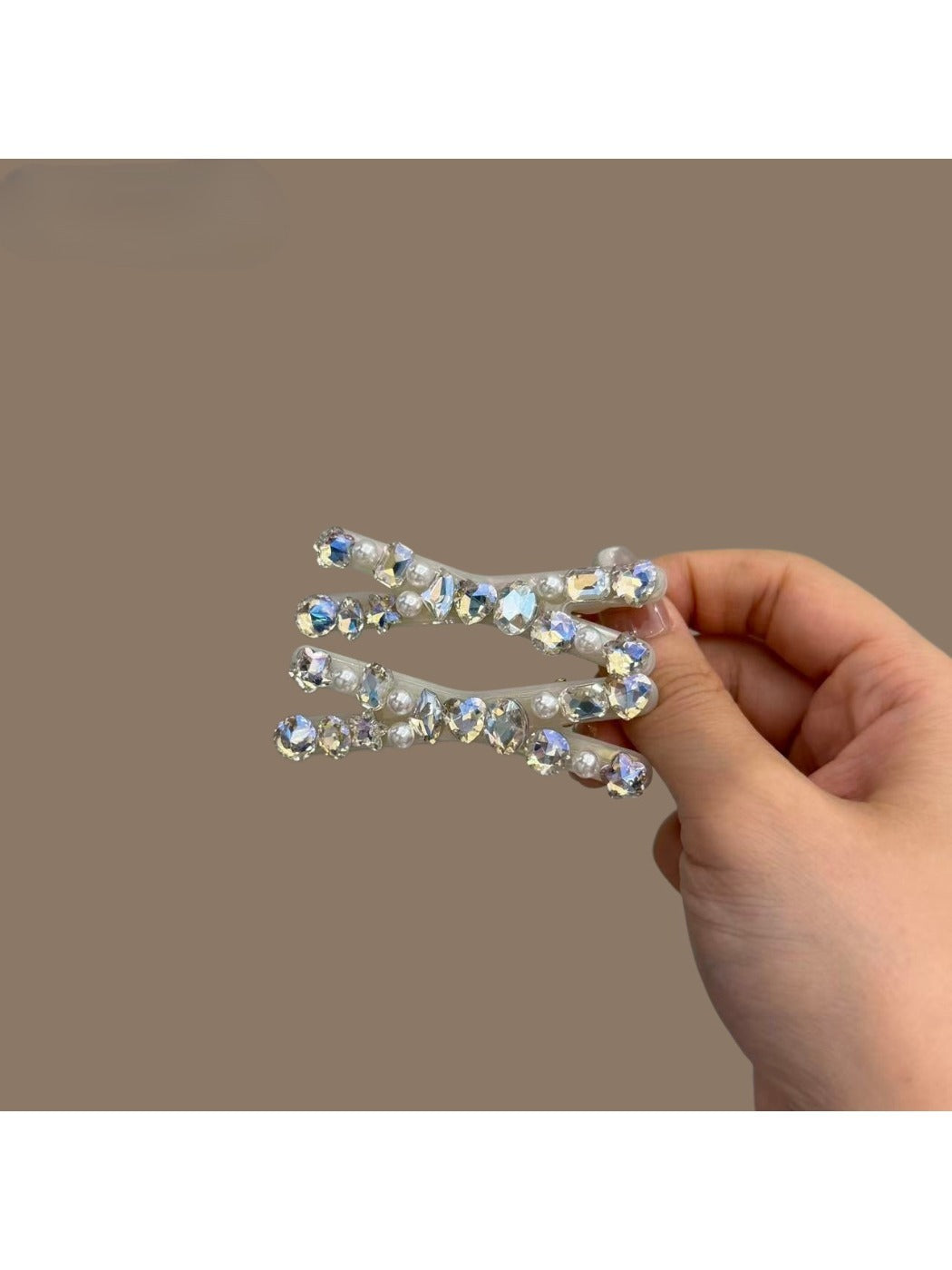 Beau sparkly crisscross bar hair clip styled in blonde hair