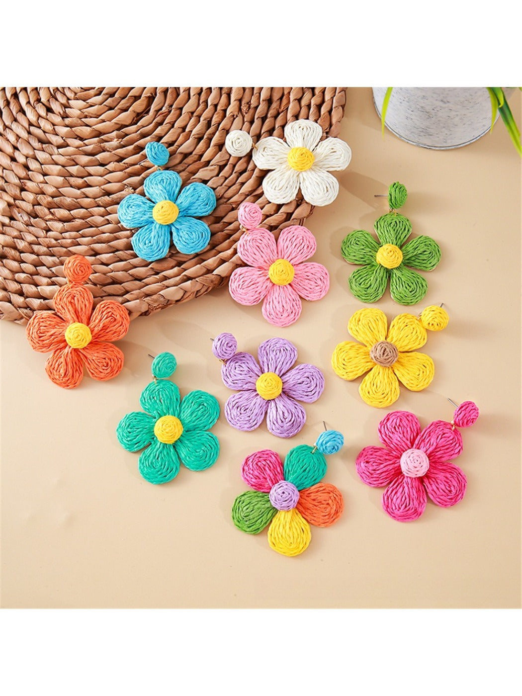 Close-up of a single earedge flower shaped knitted earring in pastel pink