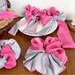 Magenta striped scrunchie styled on a ponytail