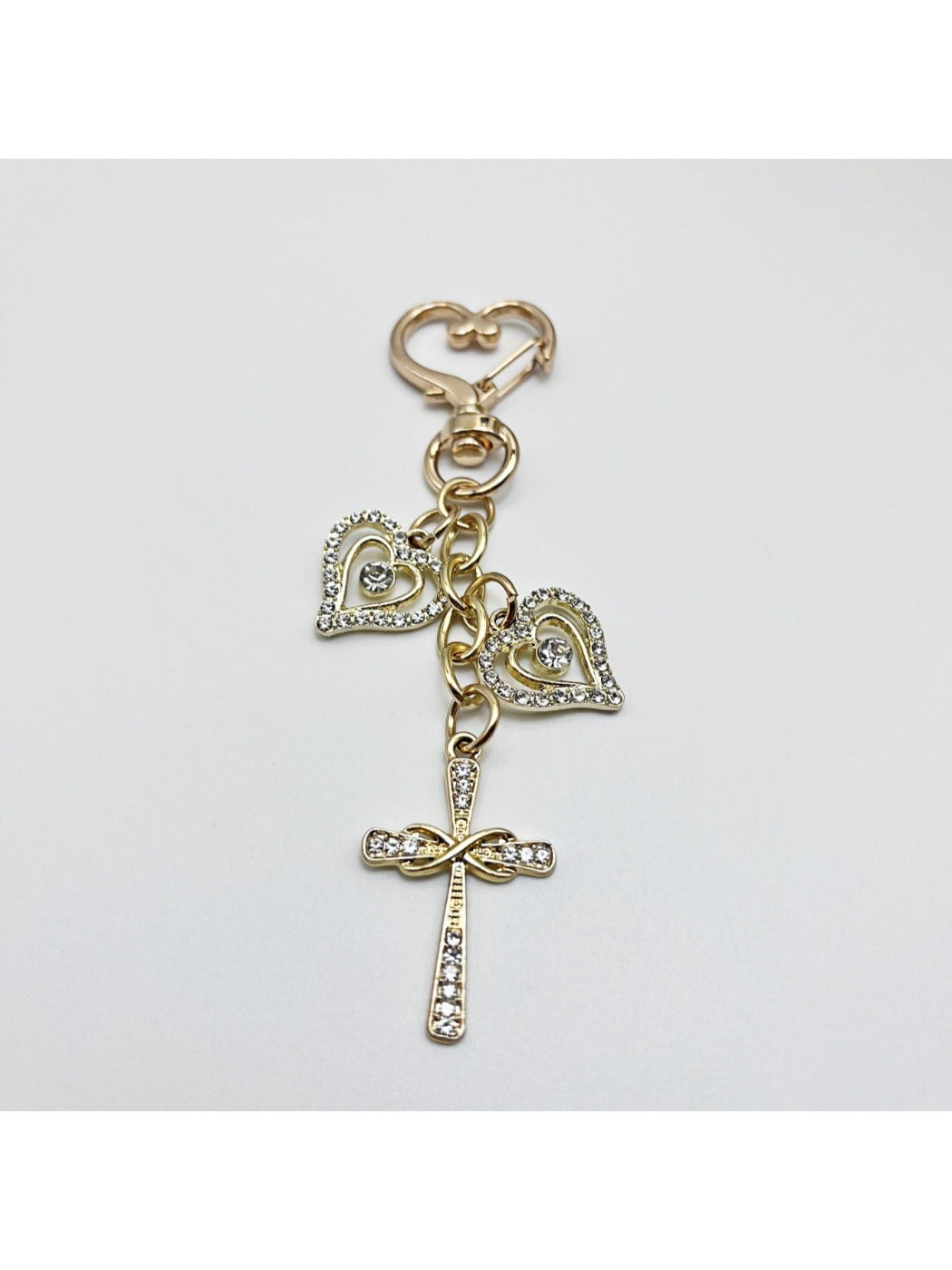 Top view of the keychain showing the cross pendant and keyring attachment
