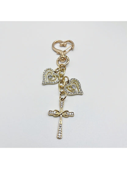 Top view of the keychain showing the cross pendant and keyring attachment