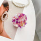 Beau hair claw clip next to seashells for decorative display