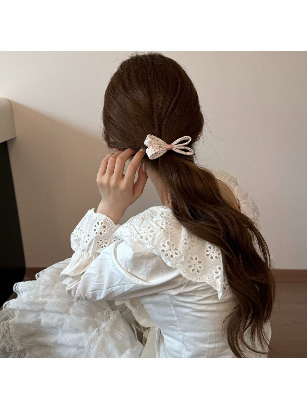 Side view of Gifty printed hair tie with pink bow detail