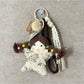 Keypus fabric cartoon doll keychain held in hand to show size and scale