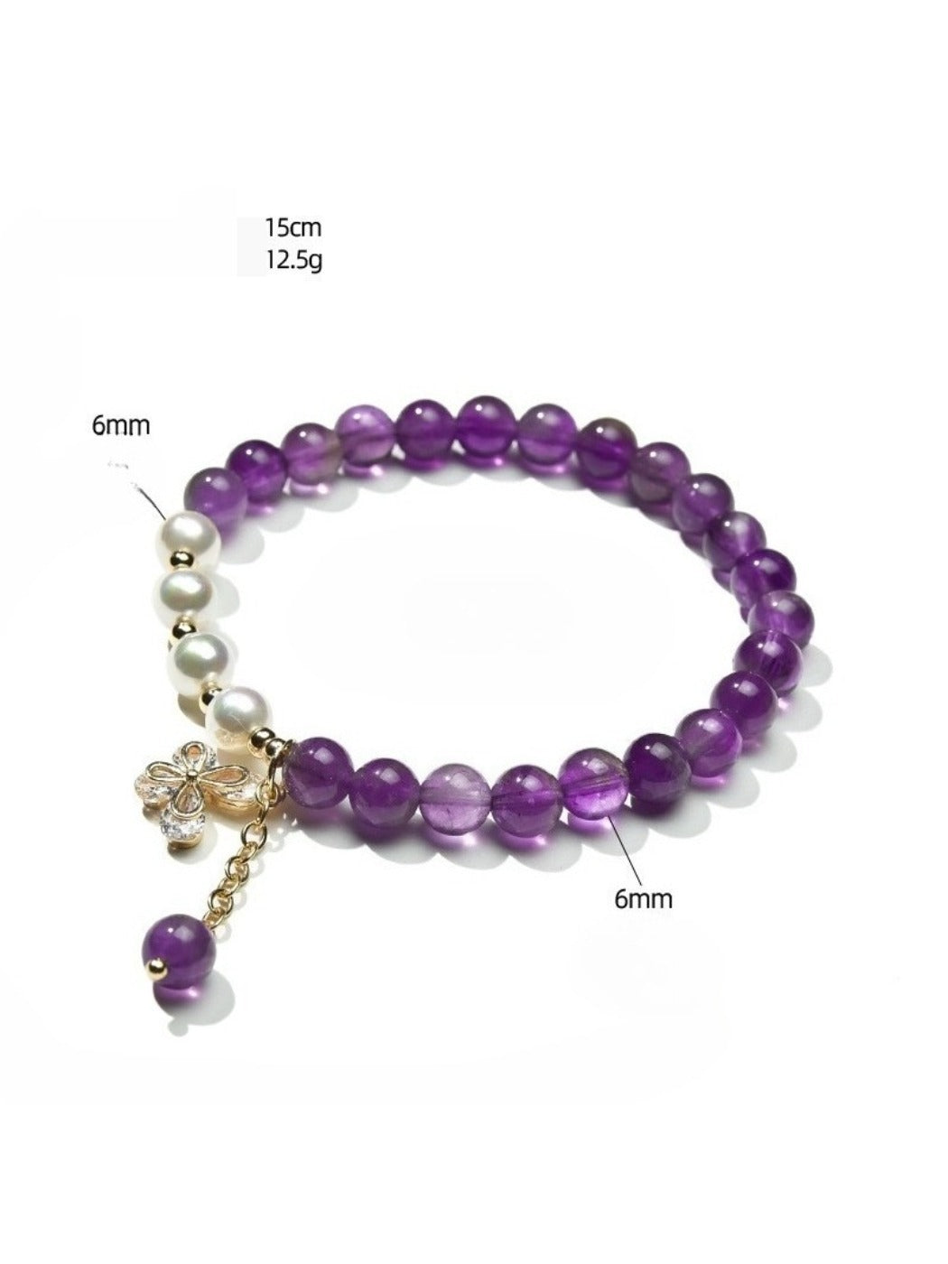 Lovra purple crystal bracelet coiled on a white surface