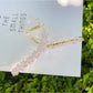 Beau flower crisscross hair claw clip on model's hair from back