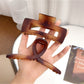 Top view of Beau square crisscross hair claw clip highlighting geometric design