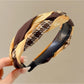 Gifty twist headband displayed flat highlighting the twisted design